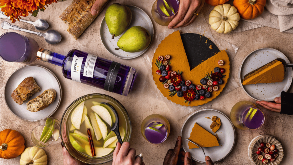 Dinner party scene with food and cocktails